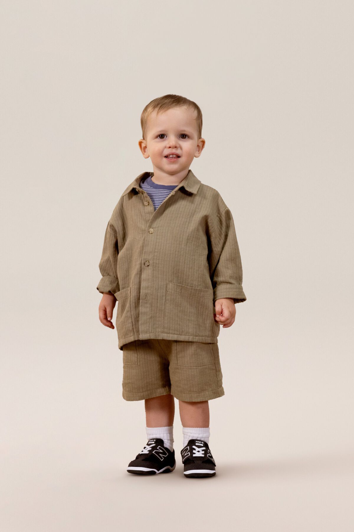 Small child standing in a matching clothing set